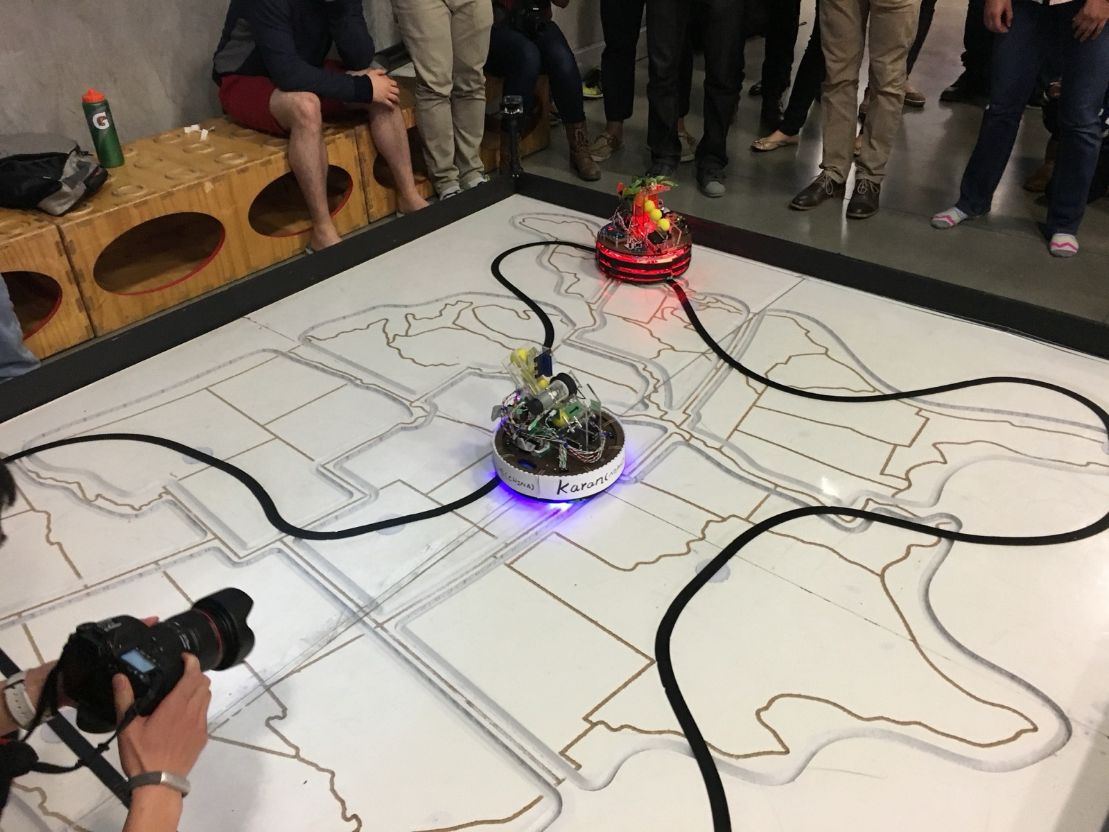 The robot competing on the 8 by 8 foot playing field during the class competition