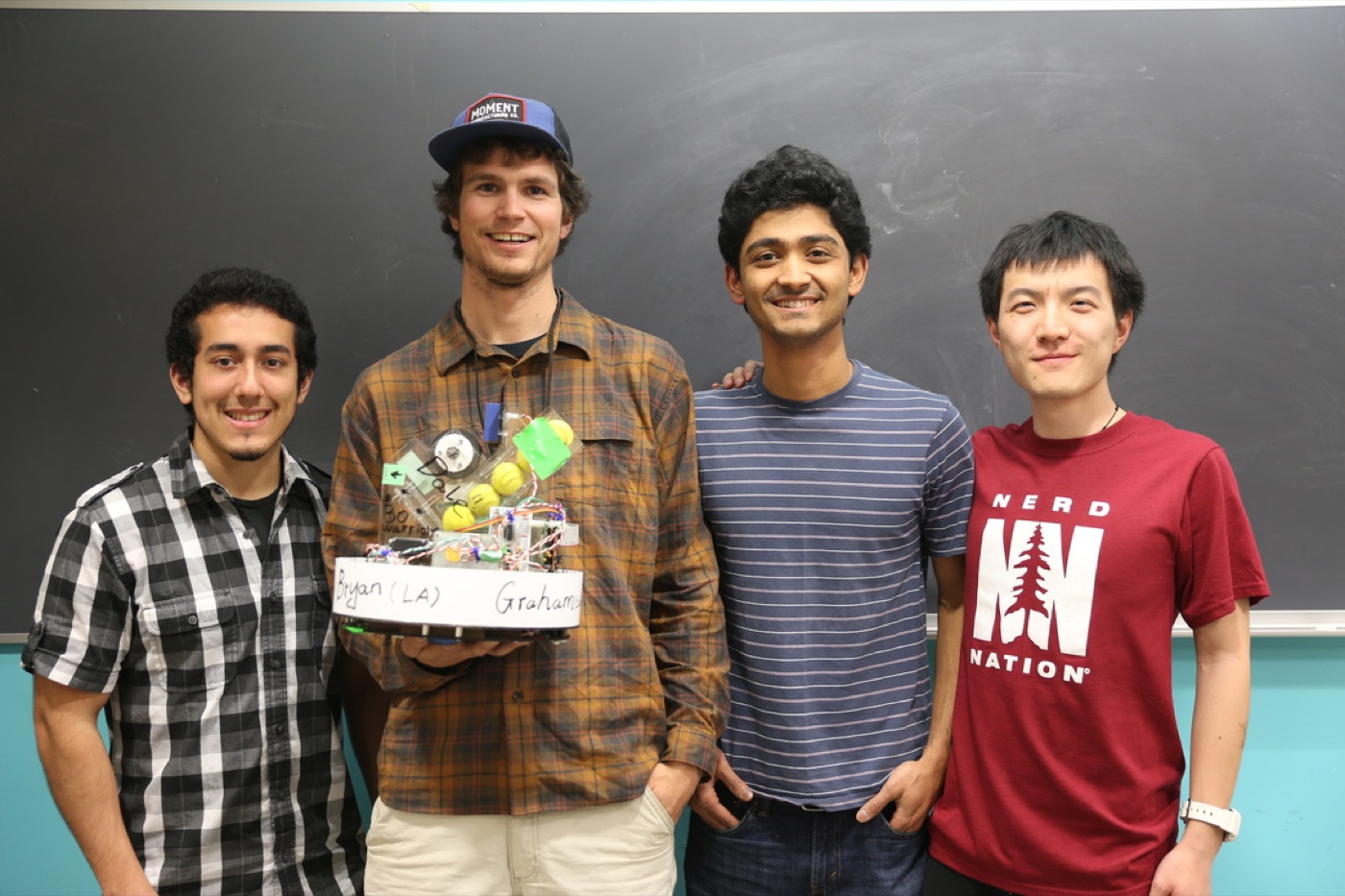 Team Dale holding the robot: Bryan Lopez, Graham Dudley, Karan Handa and Lingjie Kong